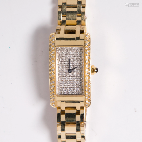 A fourteen karat gold and diamond dress wristwatch