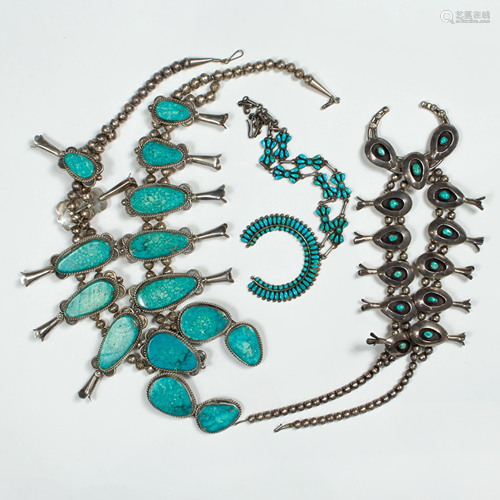 A group of turquoise and silver necklaces