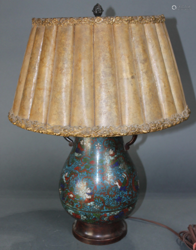 A champleve decorated table lamp in the Arts and Crafts