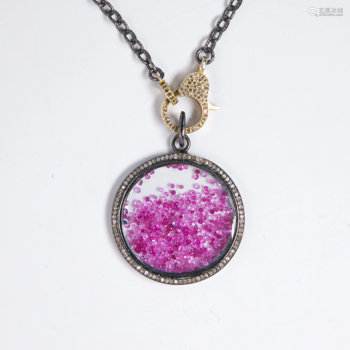 A ruby, diamond and blackened silver pendant necklace