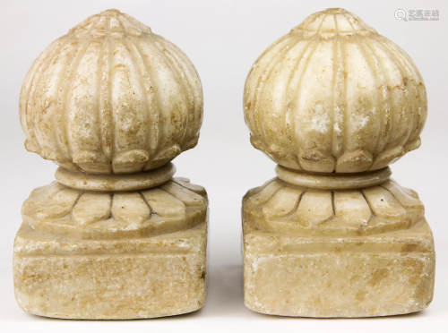 A pair of classical style marble carpet holders, early