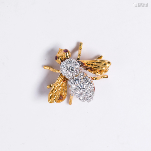A diamond and eighteen karat gold brooch