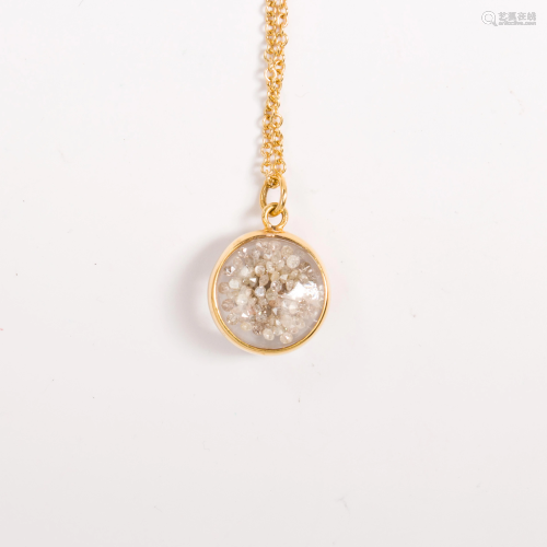 A diamond, fourteen karat gold pendant necklace