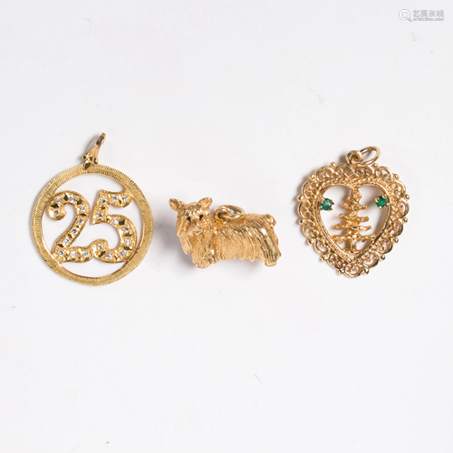 A group of fourteen karat gold charms