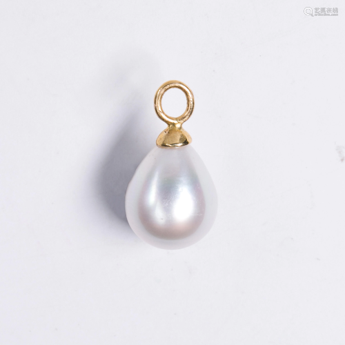 A pearl and fourteen karat gold pendant