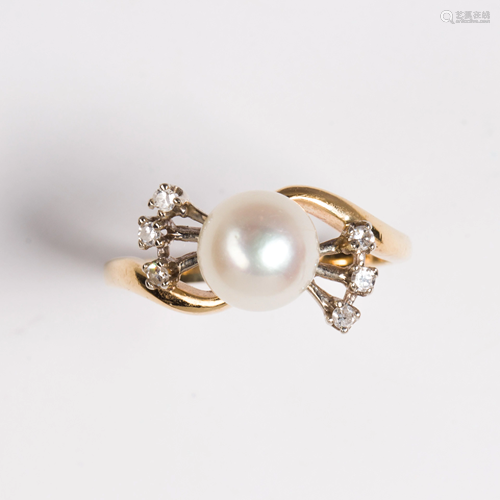 A pearl, diamond and fourteen karat gold ring