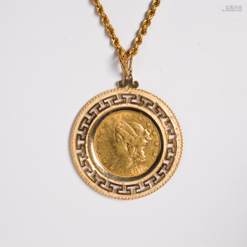 A gold coin and gold pendant necklace