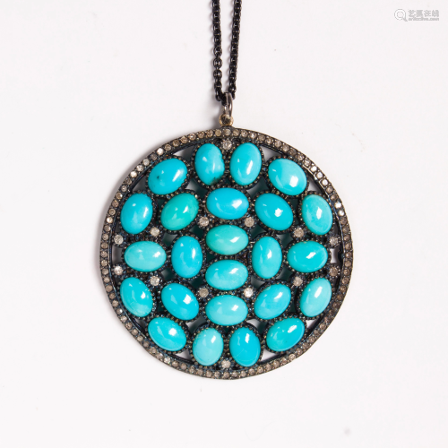 A turquoise, diamond and blackened silver pendant