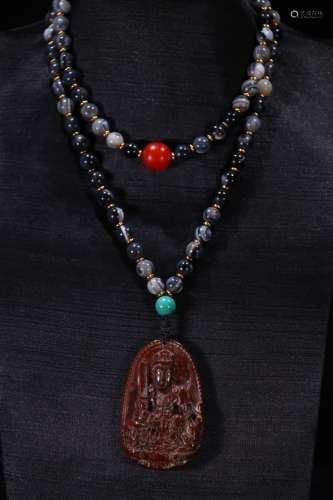 A Chinese Tibetan 7-Eye Necklace With Amber Pendant