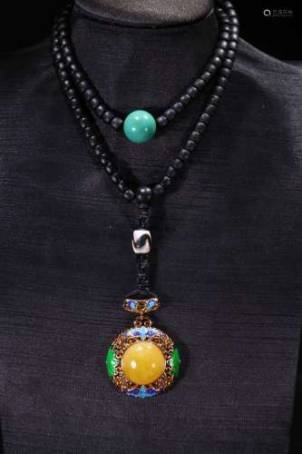A Chinese Rosewood Necklace With Amber Pendant
