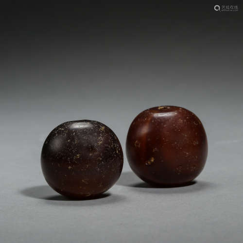 TWO CHINESE TANG DYNASTY AGATE BALLS