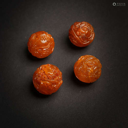 CHINESE LIAO DYNASTY AMBER BEADS WITH DRAGON PATTERN