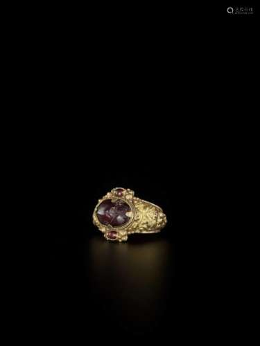 A Cham Garnet Set Gold Repouss…