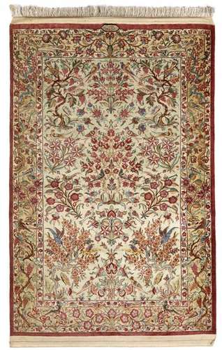 A Signed Ghom Silk Rug, Iran 1…