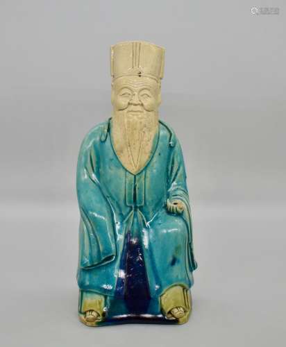 Chinese Turquoise and aubergine glazed seated official