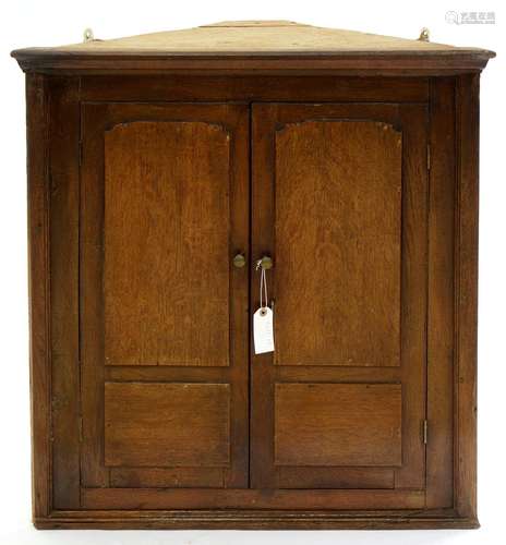 A VICTORIAN OAK CORNER CUPBOARD WITH PANELLED DOORS, 79CM H; 77 W X 33CM Scuffs and scratches