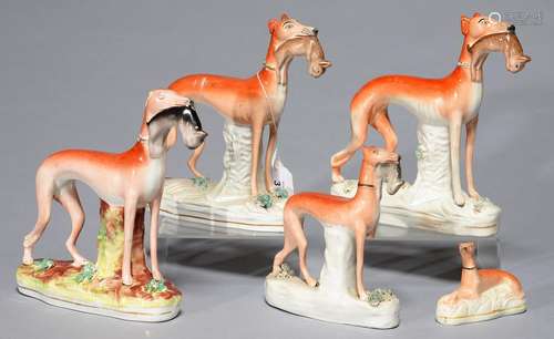 FIVE STAFFORDSHIRE EARTHENWARE MODELS OF GREYHOUNDS, MID 19TH C, THE FOUR LARGER WITH HARE, 19CM H