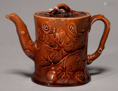 A ROCKINGHAM BROWN GLAZED BAMBOO FORM TEAPOT AND COVER, C1840, WITH RUSTIC HANDLE AND SPOUT AND