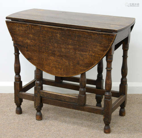 AN OAK GATELEG TABLE, SECOND HALF 18TH C, ON BALUSTER LEGS UNITED BY STRETCHERS, 70CM H; 83 X