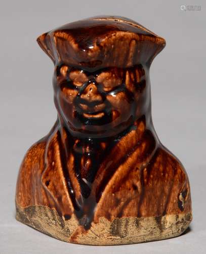 A VICTORIAN TREACLE BROWN GLAZED EARTHENWARE BANK AS THE BUST OF A SMILING MAN, C1840, THE DIPPED