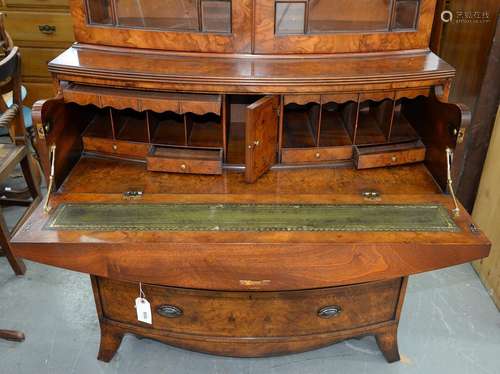 A GEORGE III STYLE BURR WALNUT BOW FRONTED SECRETAIRE BOOKCASE ON SPLAYED BRACKET FEET, 220CM H; 100