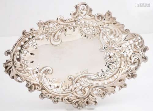 A VICTORIAN PIERCED SILVER BONBON DISH, DIE STAMPED WITH ROCAILLE AND FOLIAGE, ON FOUR OPENWORK