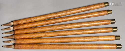 A SET OF SIX VINTAGE ASH CRICKET STUMPS, EARLY 20TH C, WITH BRASS COLLAR, 79.5CM Used but in good