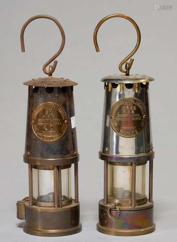 TWO BRASS AND FERROUS METAL MINER'S SAFETY LAMPS BY THE PROTECTOR LAMP AND LIGHTING CO LTD, 20TH