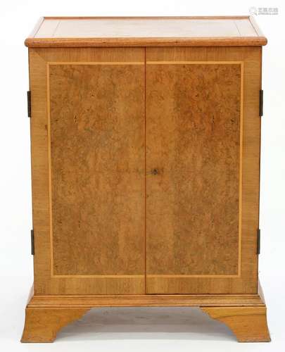 A VICTORIAN STYLE WALNUT CUPBOARD ON SPLAYED BRACKET FEET, 93CM H; 70 X 51CM Some fading, heavy in