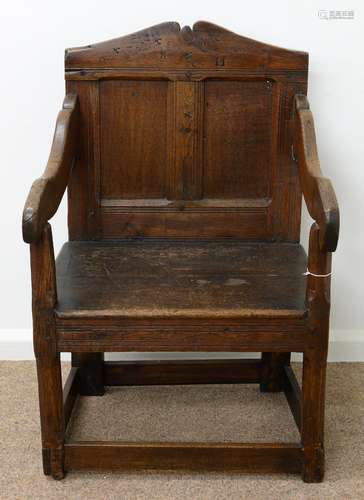 AN OAK PANEL BACK ARMCHAIR, ELEMENTS 18TH C AND ADAPTED, WITH TWIN PANEL BACK AND BOARDED SEAT ON