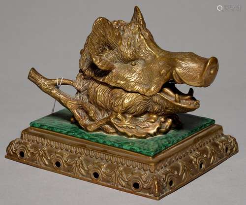 A CONTINENTAL CAST BRASS AND MALACHITE DECORATED PORCELAIN INKWELL IN THE FORM OF THE HEAD OF A