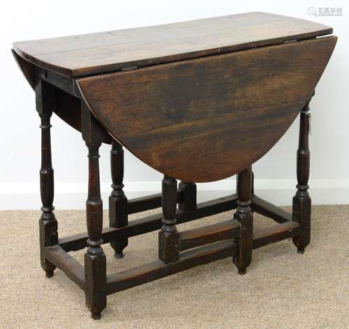 AN OAK GATELEG TABLE, SECOND HALF 18TH C, THE OVAL TOP FITTED WITH A DRAWER, ON TURNED LEGS UNITED