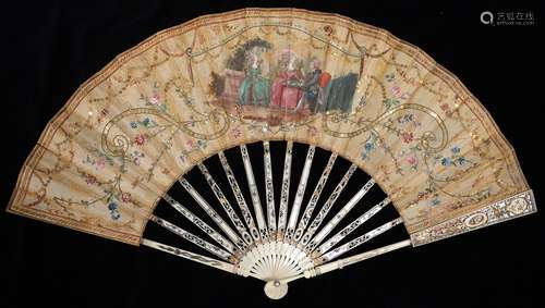 A FAN, EARLY 19TH CENTURY, THE SILK LEAF PAINTED WITH CARD PLAYERS AND FLOWERS, FRAMED BY FESTOONS