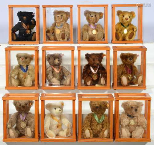 TWELVE STEIFF TEDDY BEARS, LATE 20TH / EARLY 21ST C, EACH IN ACRYLIC GLAZED LIGHTWOOD DISPLAY CASE