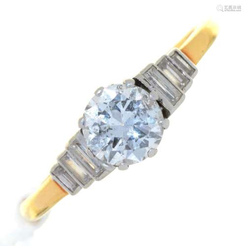 A DIAMOND SOLITAIRE RING, WITH ROUND BRILLIANT CUT DIAMOND AND BAGUETTE DIAMONDS TO THE SHOULDERS,