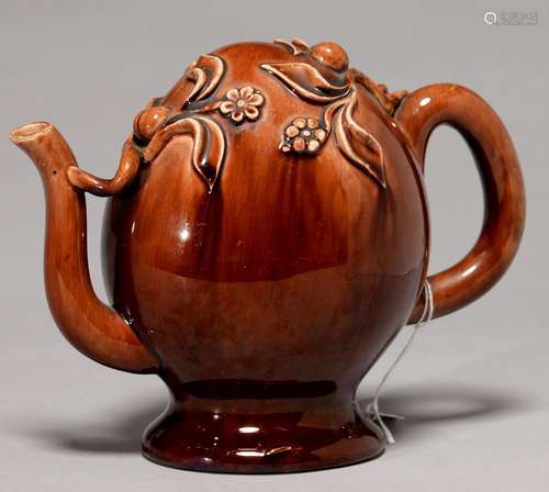 A BRAMELD TYPE ROCKINGHAM BROWN GLAZED CADOGAN TEAPOT, C1840, 16CM H Relief decoration very slightly