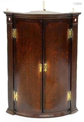 A GEORGE III OAK BOW FRONTED CORNER CUPBOARD, 28CM H; 69 X 46CM Numerous scuffs and scratches,