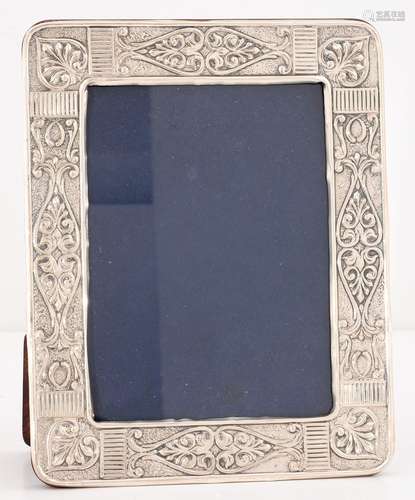 A SILVER PHOTOGRAPH FRAME, THE MOUNT DIE STAMPED WITH PALMETTES, 24 X 18.7CM, APPARENTLY UNMARKED