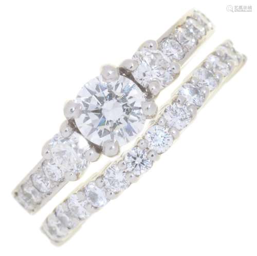 A PAIR OF DIAMOND RINGS, TO BE WORN SINGLY OR TOGETHER, ONE WITH LARGER ROUND BRILLIANT CUT DIAMOND,