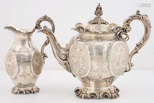 A VICTORIAN SILVER TEAPOT AND MILK JUG, GLOBULAR WITH RAISED OVAL PANELS ENGRAVED WITH FLOWERS