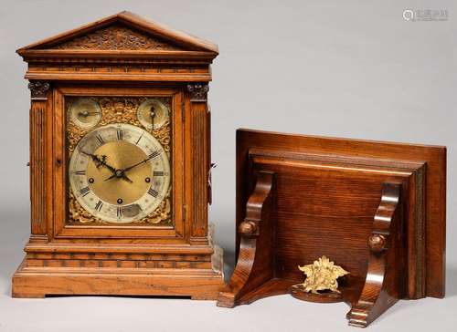 A GERMAN OAK ARCHITECTURAL CASED BRACKET CLOCK AND A BRACKET, LATE 19TH C, HAVING BRASS DIAL WITH