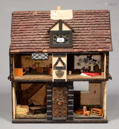 A PAINTED WOOD DOLL'S HOUSE, 1930'S, OF HALF TIMBERED TYPE WITH LINOLEUM (?) TILED ROOF, PARTLY