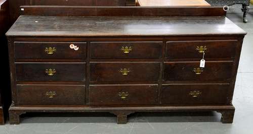 A GEORGE III OAK DRESSER ON BRACKET FEET, WITH NINE MOULDED DRAWERS, 94CM H; 198 X 52CM Handles