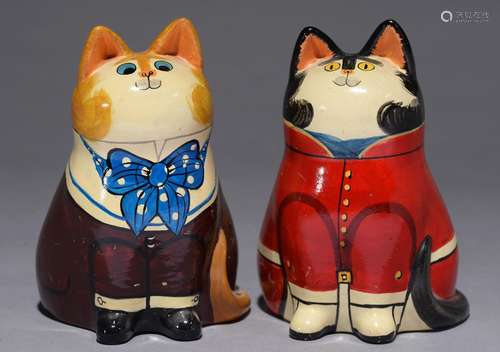 A PAIR OF ANTHROPOMORPHIC PAINTED EARTHENWARE FIGURES IN THE FORM OF SMARTLY ATTIRED CATS, C MID