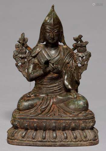 A TIBETAN BRONZE SCULPTURE OF A BODHISATTVA, SEALED, 21.5CM H Much accretion of dirt and grime,