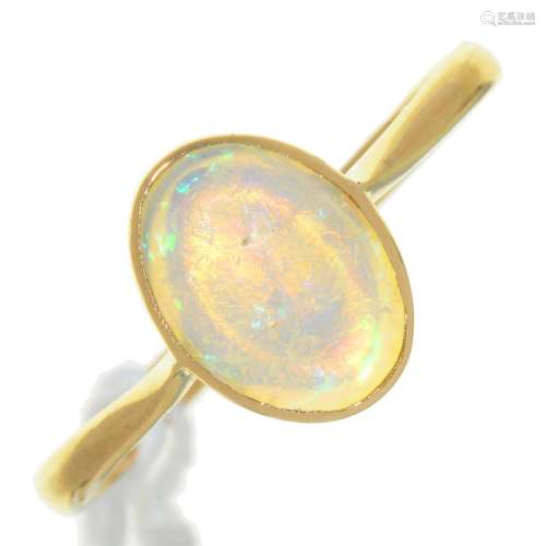 AN OPAL RING, IN GOLD, MARKED 18CT, 2.1G, SIZE N Polish of opal scratched and now rather dull; light