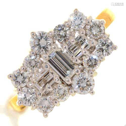 A DIAMOND CLUSTER RING WITH THREE LARGER CENTRAL EMERALD CUT DIAMONDS, IN 18CT GOLD, LONDON 2001,