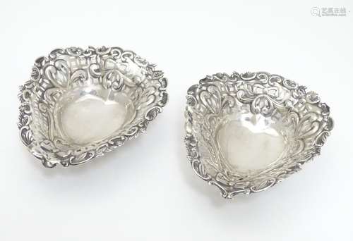 A matched pair of silver bon bon dishes of heart form, hallmarked Birmingham 1895 maker Deakin &