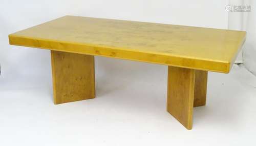 A late 20thC dining table with a large rectangular burr elm top. Bearing a 'HK Furniture Ltd'