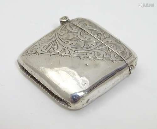 A silver vesta case with engraved decoration and hinged lid hallmarked Chester 1908 maker Smith &